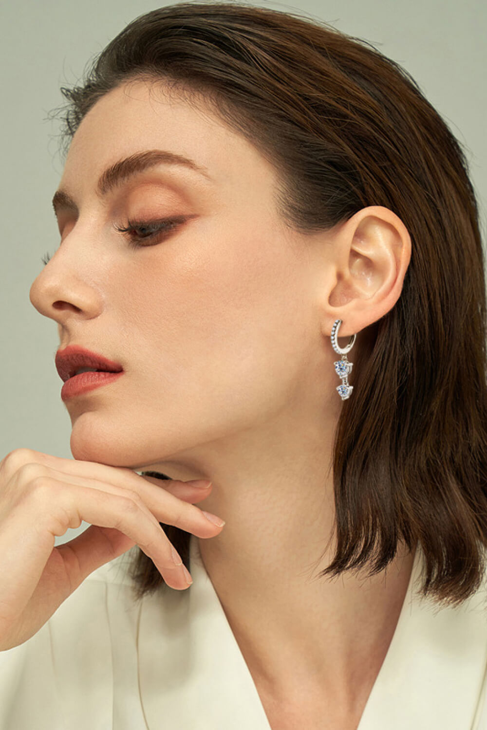 Silver hoop earrings with cascading moissanite drop charms.