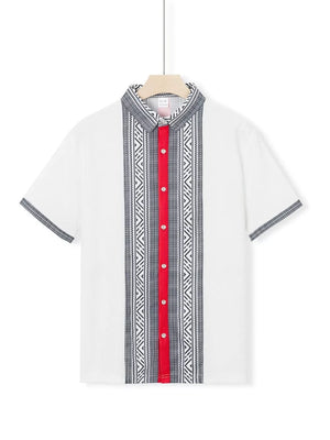 White short sleeve men's shirt with bold geometric print, red placket, and patterned collar.