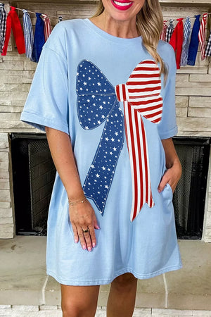 Light blue cotton blend t-shirt dress with patriotic bow graphic, short sleeves, and crew neck.