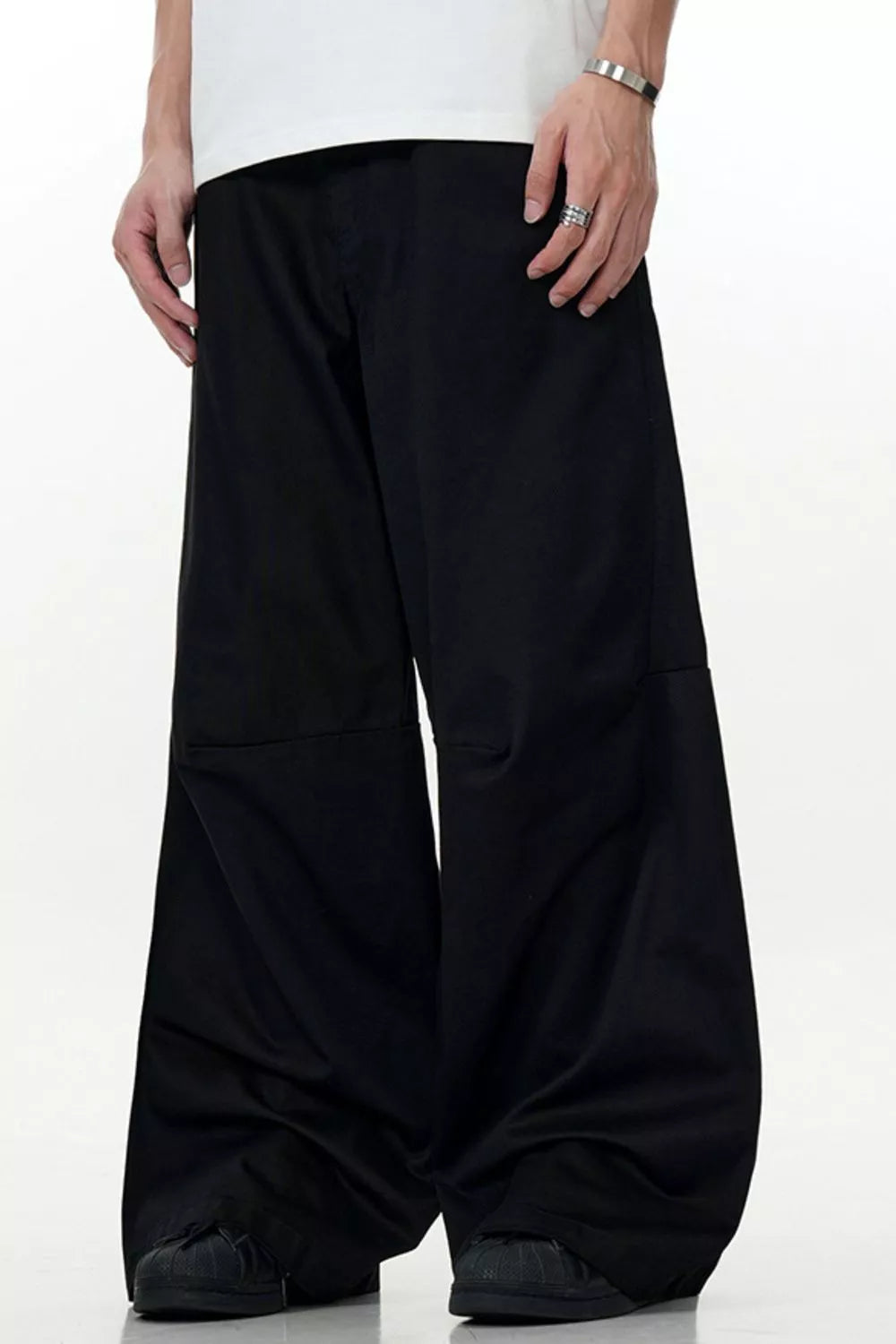 Men's black wide leg casual cargo pants with a relaxed fit and visible stitching detail.