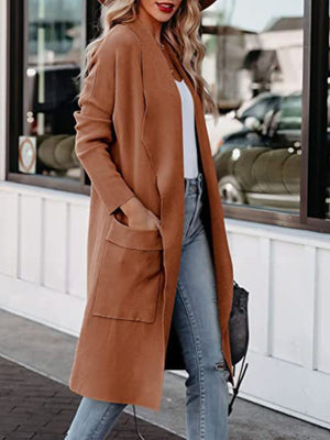 Caramel open-front duster cardigan with pockets, worn with jeans.