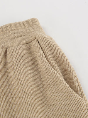Beige knit pants with pockets and elastic waistband