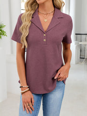 Waffle knit polo shirt in apricot with button placket and collared neckline.