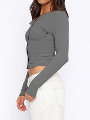 Gray ribbed button-down crop top with long sleeves and a V-neck.