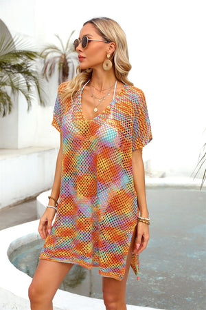 Open-knit caftan with slit hem in a multicolor sunset pattern, V-neck, short sleeves.