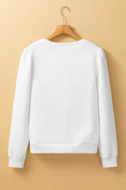 White textured puff sleeve crewneck pullover sweater with ribbed cuffs and hem.