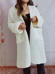 Chunky knit cocoon cardigan coat in white with open front and patch pockets.