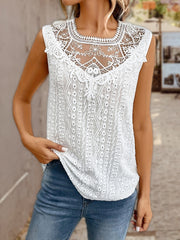 White lace yoke sleeveless blouse with eyelet embroidery and a scoop neck.