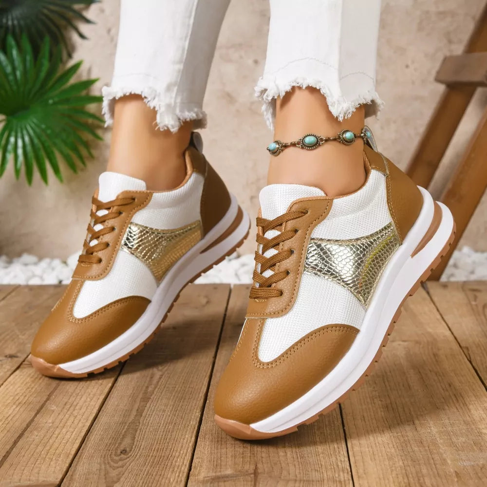 Chic lace-up sneakers in light brown and white with textured gold accents.
