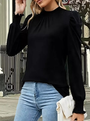 Black maternity overshirt with mock neck, gathered puff sleeves, and smocked cuffs.