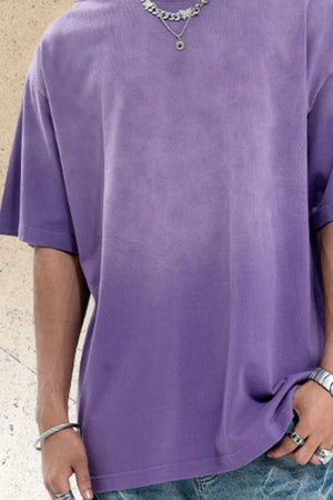 Men's purple oversized cotton t-shirt with a faded wash and crew neck.