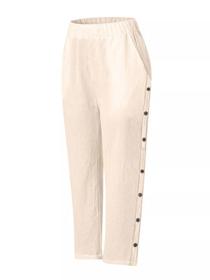 Apricot relaxed fit pants with decorative buttons down the side and elastic waist.
