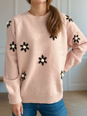 Apricot knit sweater with embroidered floral details and beaded centers.