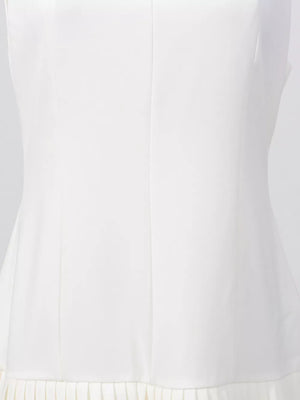 White mini dress with square neckline and pleated hem detail