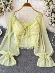Yellow green sheer maternity blouse with ruffled sleeves, bow detail and buttons