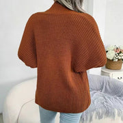 Brown chunky knit dolman sleeve cardigan with a mock neck, shown from the back.