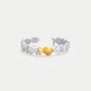Adjustable ring with a silver band and a gold fish accent, featuring a school of fish design.