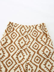 Baby shorts with elastic waist and brown diamond pattern on cream cotton.