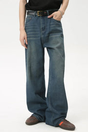 Baggy denim jeans in medium wash with subtle fading and a relaxed fit.