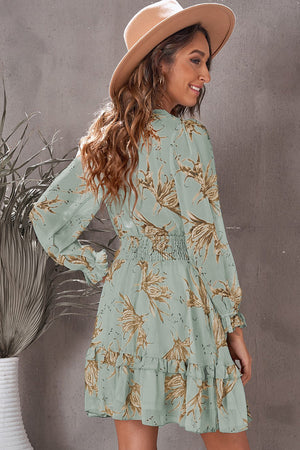 Tie-front prairie dress in Gum Leaf with floral print, smocked waist, and ruffled hem.