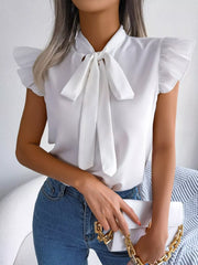 White pussy-bow blouse with ruffle cap sleeves and a tie neck.