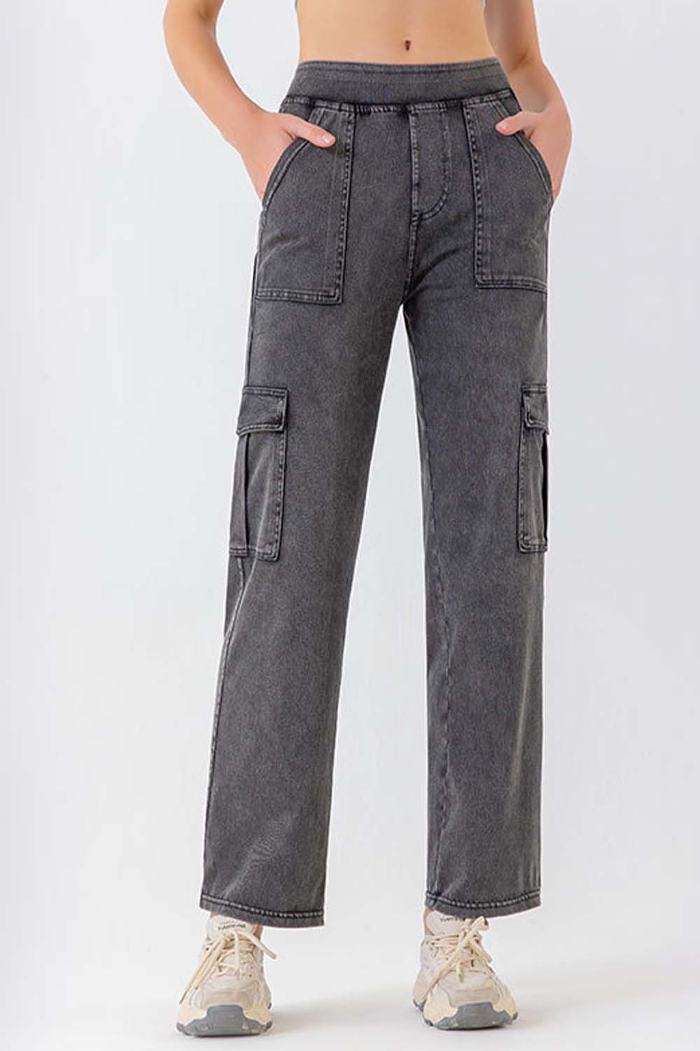 Utility denim cargo pants in gray with multiple pockets and a relaxed fit.