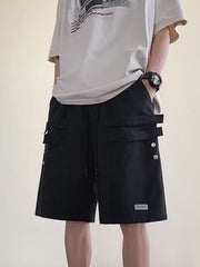 Men's black cargo shorts with drawstring and double strap pocket detail.