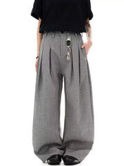Men's grey wide-leg pleated sweatpants with a key chain detail.