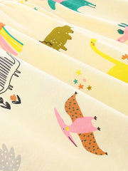 Baby dress in cream cotton with a whimsical dinosaur print.