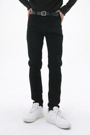 Black slim-fit stretch denim trousers with a black belt.