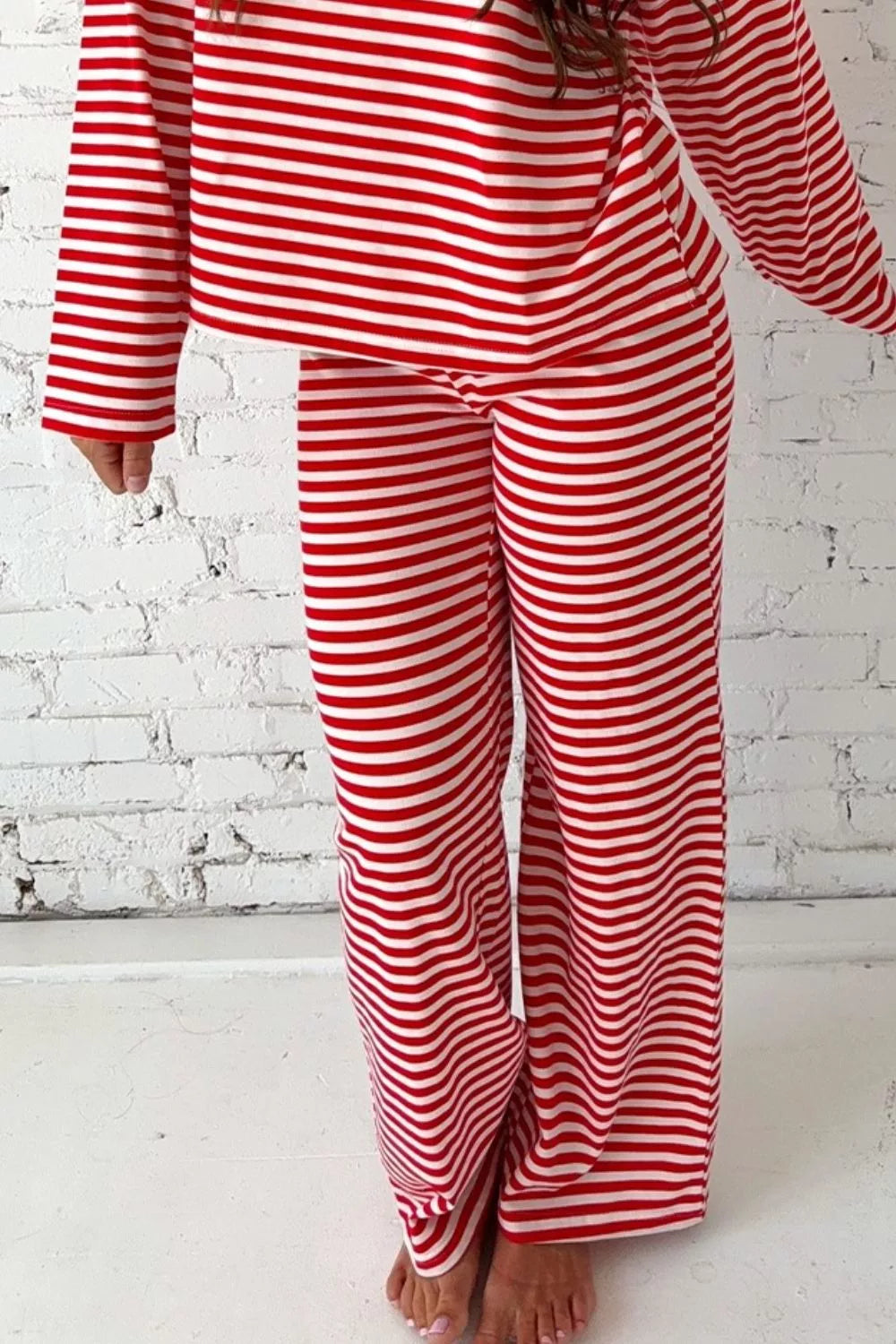 Red and white striped cotton blend loungewear set with long sleeves and wide leg pants.