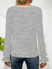 Striped white and black blouse with ruffle cuffs and square neckline.