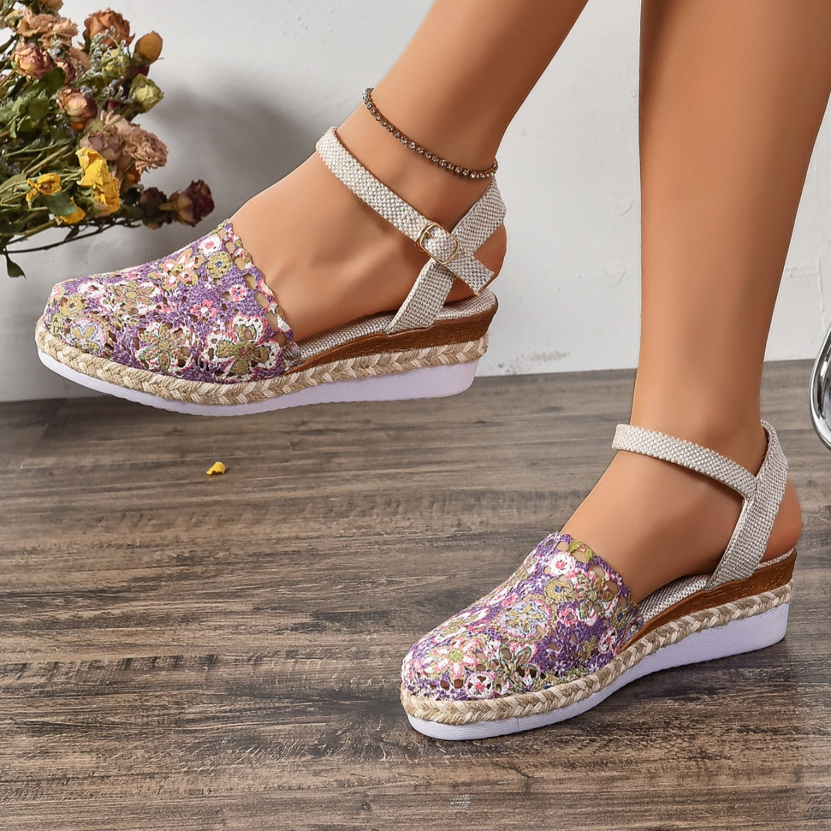Floral espadrille sandals in purple with ankle strap and jute trim.