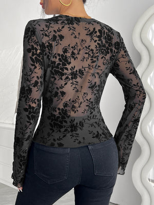 Black floral burnout lace long sleeve blouse with sheer fabric.