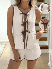 Beige tie-front sleeveless top and shorts set with brown trim and ties