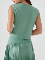 Sculpted crop active muscle tee in teal, sleeveless, crewneck, cropped length.