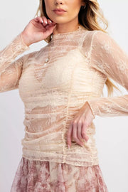Cream lace ruched maternity shirt with mock neck and long sleeves.