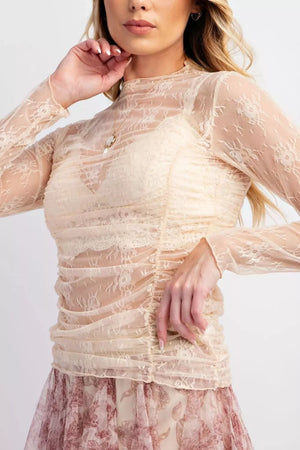 Cream lace ruched maternity shirt with mock neck and long sleeves.