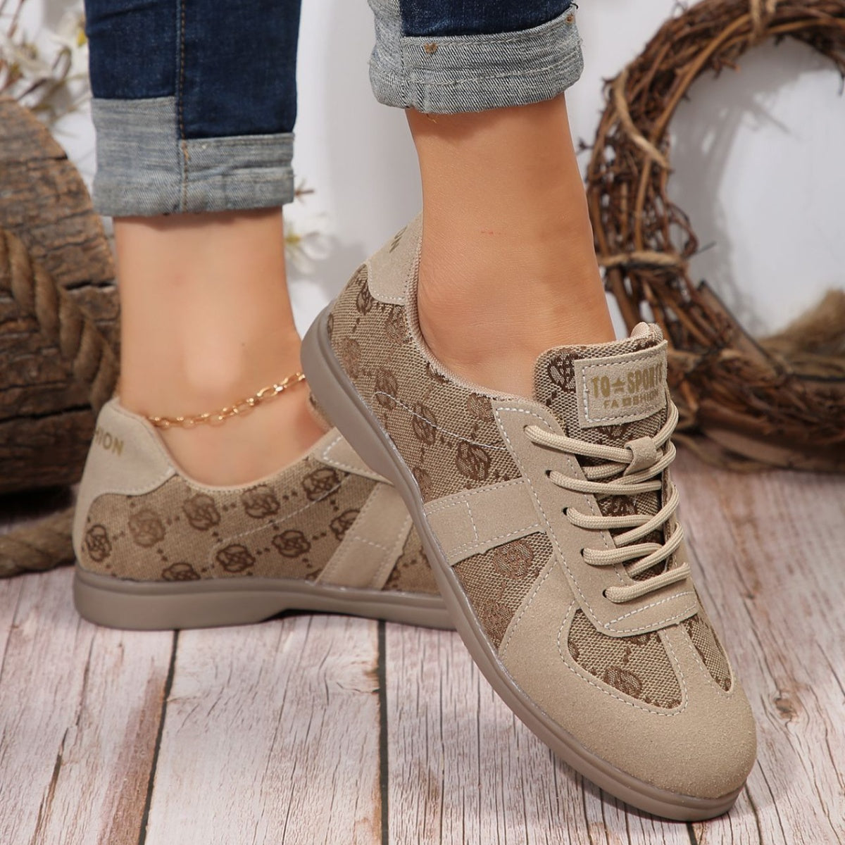 Chic lace-up sneakers in beige with monogram pattern and suede accents.