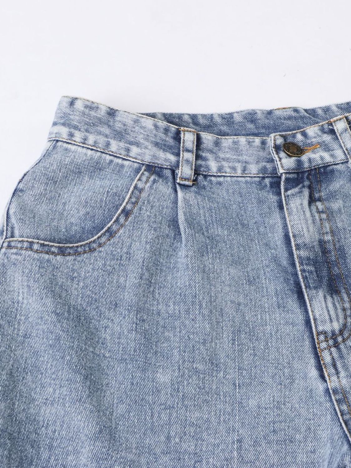 Light wash barrel leg jeans with front pocket detail and button fly.