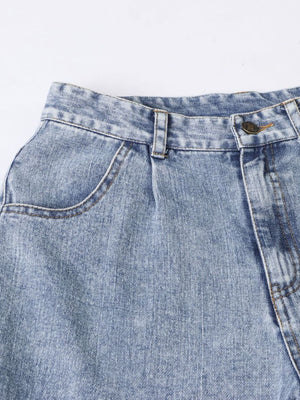 Light wash barrel leg jeans with front pocket detail and button fly.