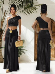 Black one-shoulder ruched crop top and maxi skirt set with gold floral detail