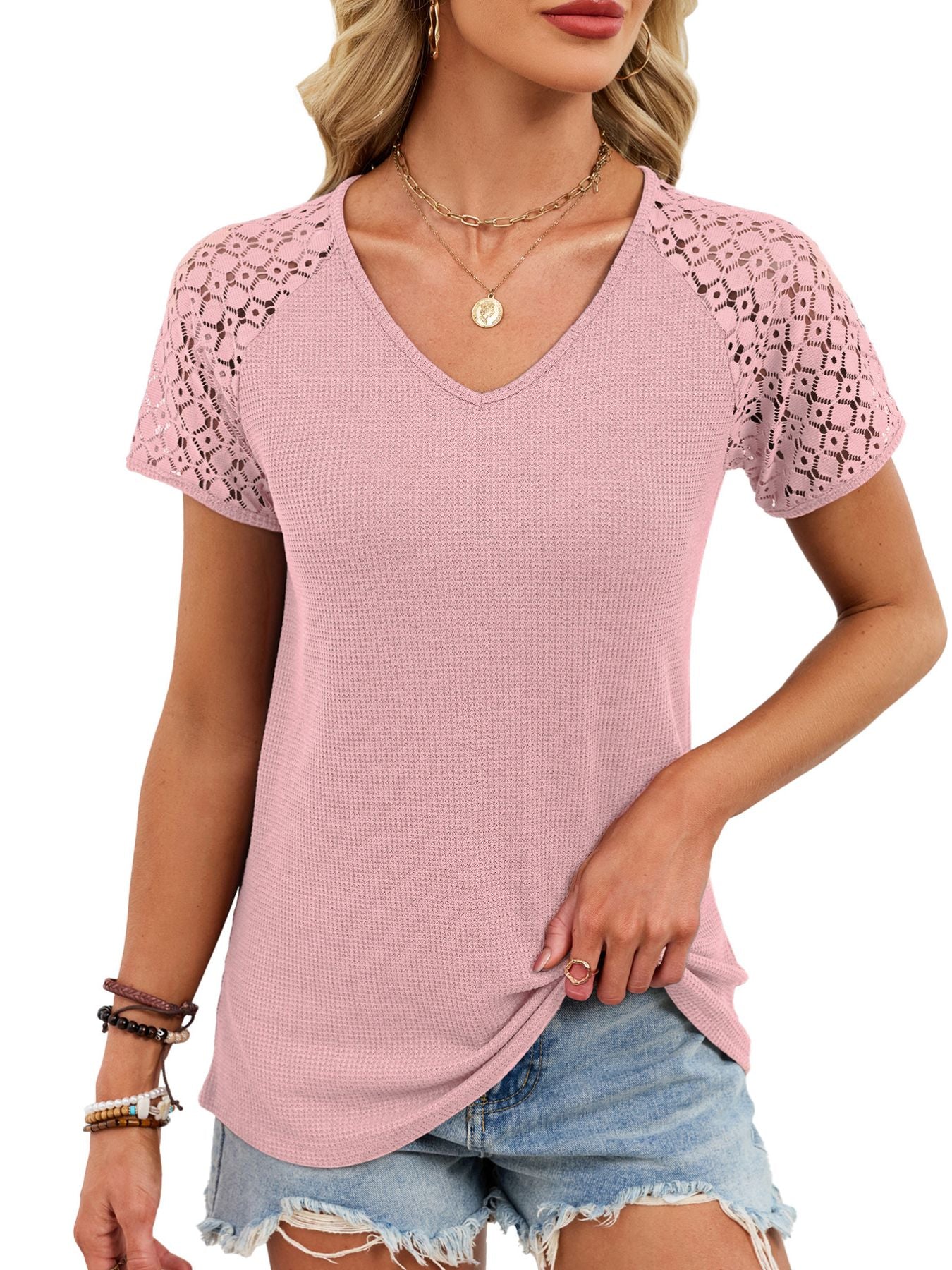 Pink waffle knit t-shirt with geometric lace short sleeves and V-neck.