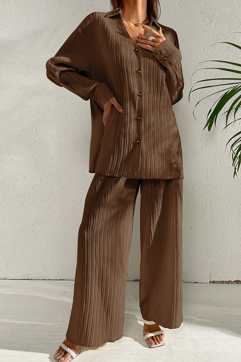 Brown pleated co-ord set with button-down shirt and wide leg trousers