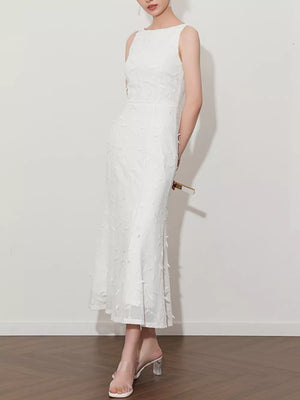 White midi dress with floral applique, boat neck, and a-line cut.