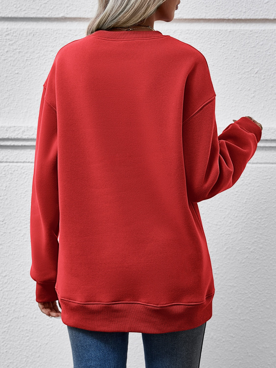 Deep Red crewneck sweatshirt with ribbed cuffs and hem, relaxed fit.