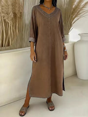 Effortless midi dress in dark brown with V-neck, 3/4 sleeves, and side slit.
