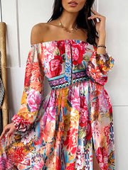 Vibrant off-shoulder maxi dress with balloon sleeves and a high slit, featuring a colorful floral print.