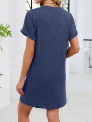 Navy blue t-shirt dress with cuffed short sleeves and a V-neckline, above the knee length.