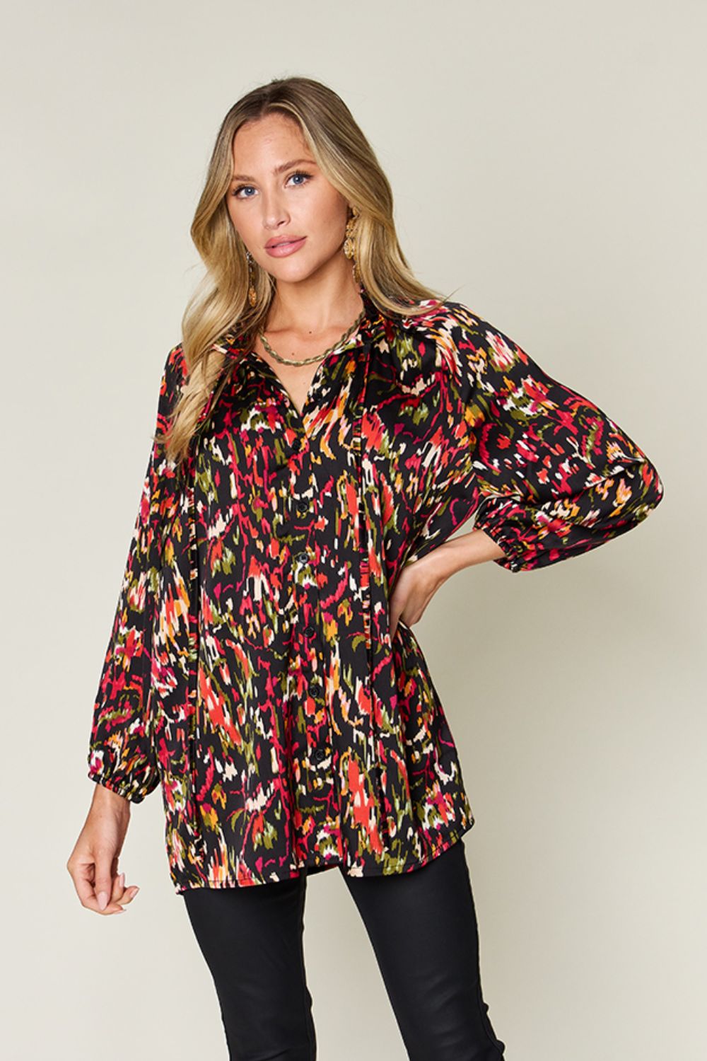 Silk tie-neck blouse with abstract print and button closure